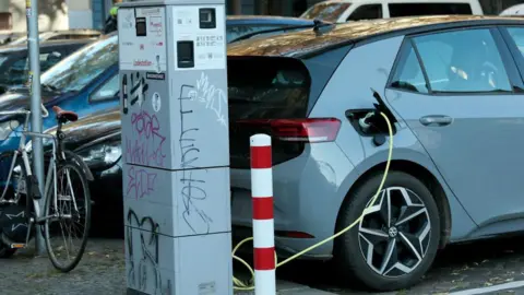 Getty Images An electric car being charged in Germany 