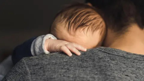 Getty Images Dad with baby