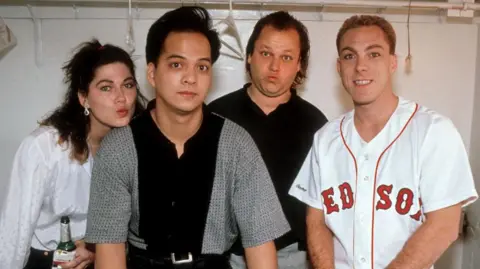 Getty Images The original line-up of Pixies, circa 1989, strike goofy poses backstage at a concert