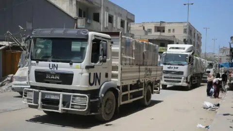 Getty Images Aid trucks in Gaza in June