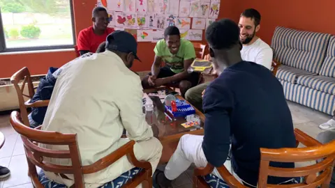 BBC Smiling asylum seekers playing the game bingo at a hotel in northern Spain