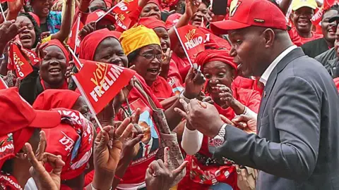 EPA Daniel Chapo (L) at a campaign event at the China Mozambique Cultural Centre in Maputo, Mozambique, 02 October 2024