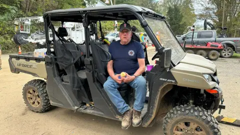 Green Valley Fire Chief sits in lorry