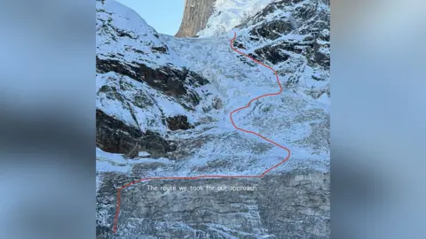 Fay Manners A photo of a steep ice covered mountain face with a red line drawn across it and labelled 