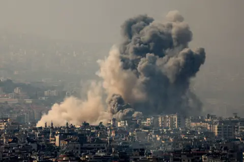 Reuters Smoke rises over Dahieh in Beirut's southern suburbs after Israeli air strikes on Satruday night.