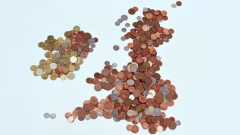 Map of the British Isles made out of coins - 1p, 2p, 5p, 10p, 20p for the UK and euros for the Republic of Ireland. The coin currency used for the United Kingdom are coppers.