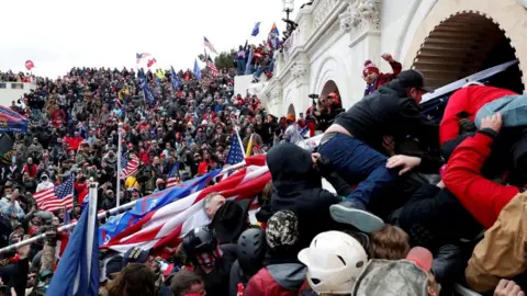 Reuters/Shannon Stapleton File image of Donald Trump supporters attacking the US Capitol building on 6 January 2021