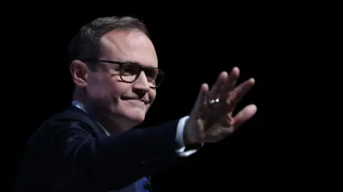 EPA Conservative Party Leadership candidate Tom Tugendhat waves at the crowd during a speech at the final day of the Conservative Party Conference in