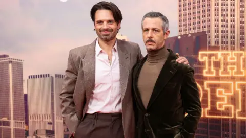 Reuters Cast members Sebastian Stan and Jeremy Strong pose during a presentation for the film The Apprentice at the BFI London Film Festival 