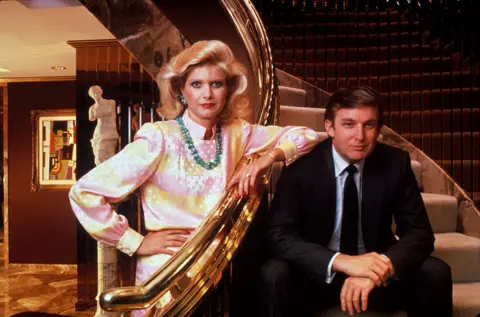 Getty Images Donald and Ivana Trump pose beside the golden banister of their staircase.