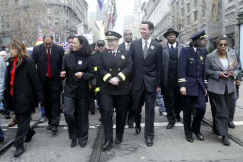 Getty Images District attorney Kamala D. Harris (left), fire chief Joanne Hayes White (centre) and San Francisco Mayor Gavin Newsom attend the Martin Luther King, Jr. Freedom March in 2004.