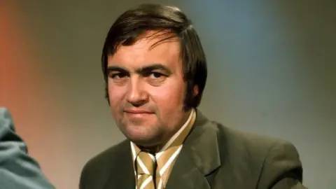 Rex Features John Prescott in 1970 wearing a brown suit and yellow and white striped tie and shirt