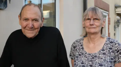 Richard and Katherine Phillips looking into the camera