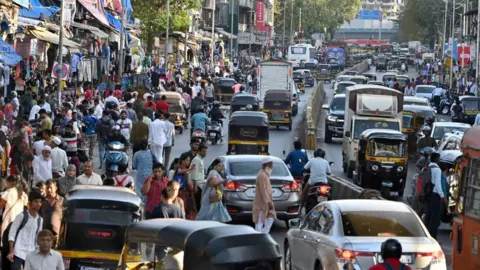 Getty Images MUMBAI, INDIA MAY 2: Hawkers encroach the footpath and the road outside the station, at Andheri (West), on May 2, 2023 in Mumbai, India. (Photo by Vijay Bate/Hindustan Times via Getty Images)