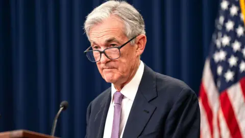 Getty Images Jerome Powell stands at a lectern