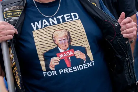 AFP  A demonstrator stands outside the E. Barrett Prettyman US Courthouse in Washington, DC, on August 3, 2023, ahead of the arraignment of former US President Donald Trump