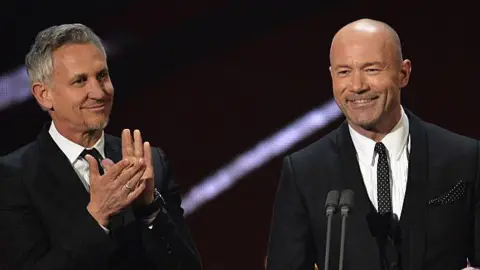 Getty Images Gary Lineker and Alan Shearer in suits on stage at the National TV Awards in 2017