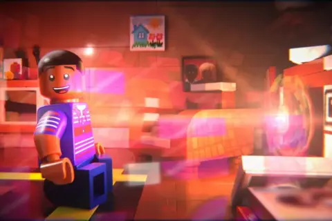 Focus Features A scene from the movie Piece By Piece, where Pharrell Williams is transported by music coming out of his parent's stereo system. He is a blue Lego figure with short dark hair and is looking animated by lots of coloured lights surrounding him.