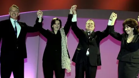 PA Media John Prescott with his wife Pauline and Tony and Cherie Blair at the 2006 Labour Party conference