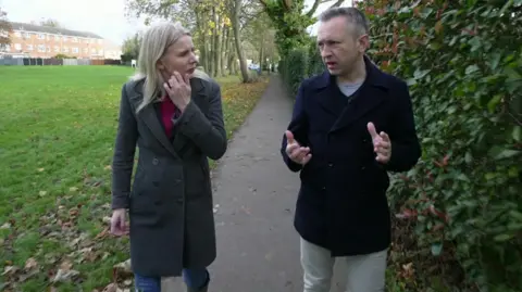 Rebecca Paul interviews Dr David Montgomery as she walks around a park in Banstead.