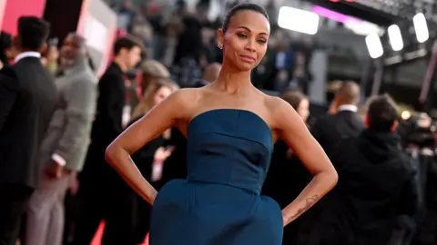 Getty Images US actor Zoe Saldaña poses on the red carpet upon arrival to attend the Gala screening of 