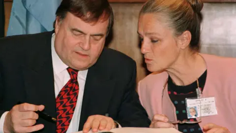 Reuters Deputy Prime Minister John Prescott signs the Kyoto treaty on climate change after EU Environment Commissioner Ritt Bjerregaard, at the United Nations in New York