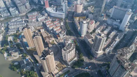 Getty Images Aerial picture of Wuxi. It shows roads and several high-rise buildings