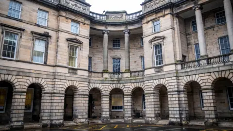 PA Media The Court of Session building in Edinburgh - an old stone building with lots of pillars and windows 