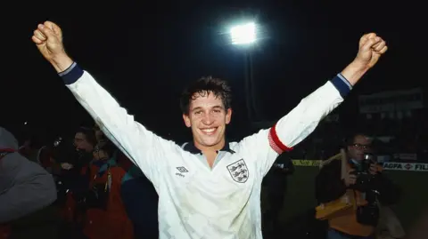 Getty Images Gary Lineker celebrating qualifying for Euro 92 after the match between Poland and England in 1991, in England shirt with arms raised