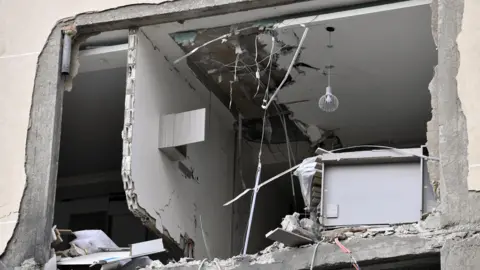 EPA Damaged multi-storey residential building following an Israeli air strike in Aramoun, Lebanon (13 November 2024)