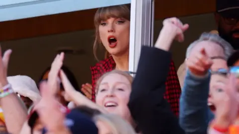 Getty Images Taylor Swift with mouth agape in the crowd