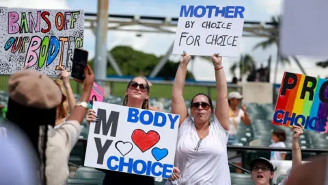 Getty Images Abortion rights supporters rally in Miami, Florida in September in support of Amendment 4. They hold signs that read 