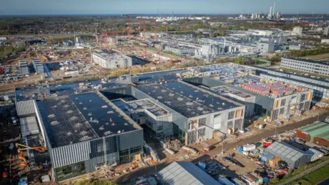 Getty Images Factories and red cranes tower over a huge construction for the main production centre for weight loss drug Wegovy, owned by company Novo Nordisk.