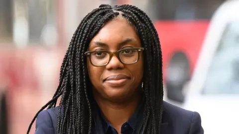 Getty Images Close up of Kemi Badenoch wearing a dark blue suit arriving at the Post Office Inquiry