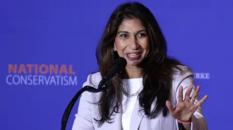 Getty Images Suella Braverman speaking at a National Conservatism conference in Washington in July