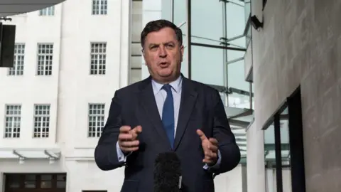 Getty Images Mel Stride speaking to the media outside the BBC's Broadcasting House in London during the general election campaign 