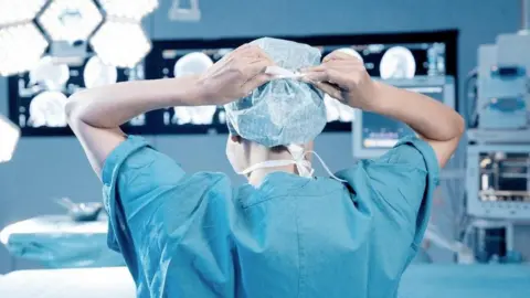 Getty Images A surgeon prepares for an operation