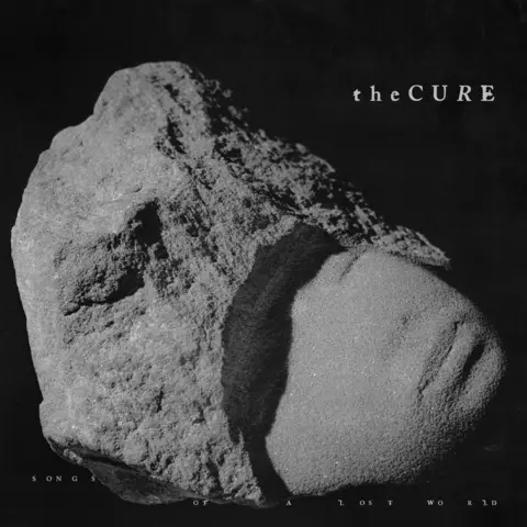 Fiction Artwork for The Cure's album, Songs Of A Lost World it shows a lump of grey rock