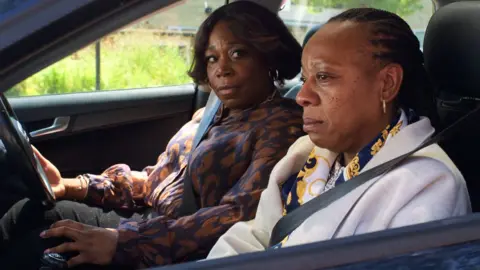 Studio Canal Michele Austin and Marianne Jean-Baptiste in Hard Truths, seen sitting in the two front seats of a car