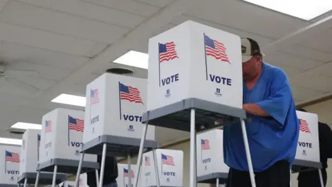 Getty Images Wisconsin voters cast their ballots at the American Legion Hall on 5th November