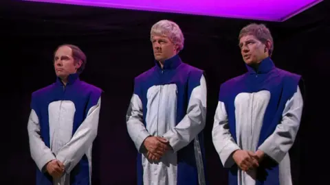 Three Time Lords (Bernard Horsfall, Trevor Martin and Clyde Pollitt) standing in robes looking solemn