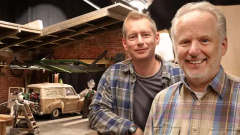 Aardman Animations Directors Merlin Crossingham and Nick Park on one of the film's sets