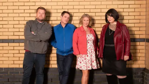 BBC/Toffee International Ltd./Tom Jackson James Corden, Mathew Horne, Joanna Page, and Ruth Jones pictured in a promo image for the upcoming Gavin & Stacey finale.