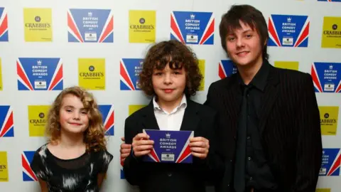 Getty Images Right to left: Ramona Marquez, Daniel Roche and Tyger Drew-Honey at the British Comedy Awards in 2009