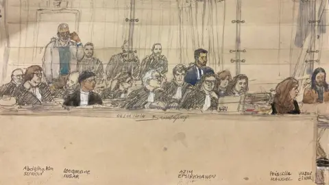 Getty Images A court sketch of five of the defendants (L-R) Abdelhakim Sefrioui, Louqmane Ingar, Azim Epsirkhanov, Priscilla Mangel and Yusuf Cinar sitting during the trial during a hearing on 4 November 2024