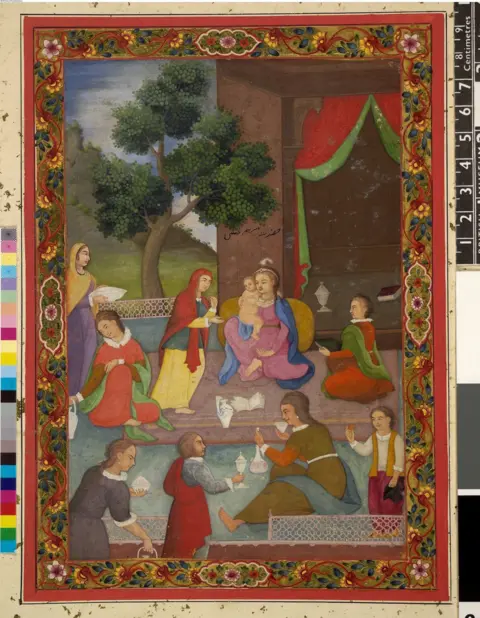 The Trustees of the British Museum Mary in blue cloak and mauve dress, seated on a terrace holding baby Jesus, surrounded by attendants holding various bowls and dishes. A tree and a building with red and green curtains in background. Ornate colourful floral border.