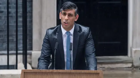 Getty Images On 22 May, former British Prime Minister Rishi Sunak made a statement in the rain outside 10 Downing Street announcing a UK general election would take place on 4 July in London, UK