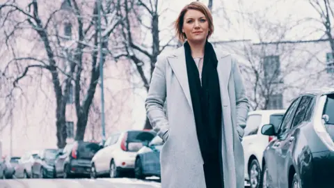 Christina Bu Christina Bu, the secretary general of the Norwegian EV Association, stands on a snowy street