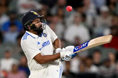 AFP Indian batsman Rohit Sharma is hit by the ball on the second day of the second Test cricket match between Australia and India at the Adelaide Oval in Adelaide on December 7, 2024.