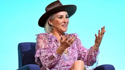 Getty Images Ricki Lake in hat and floral dress